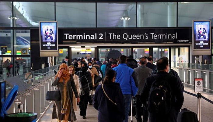 People queue to enter terminal 2 at Heathrow Airport in London, Britain, January 18, 2021. — Reuters