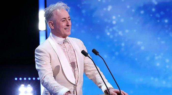 Racial slur during BAFTAs prompts on-air apology from host Alan Cumming