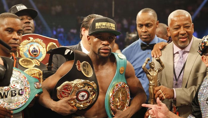 Floyd Mayweather, Jr poses with his title belts after defeating Manny Pacquiao in Las Vegas, US on May 3, 2015. — Reuters