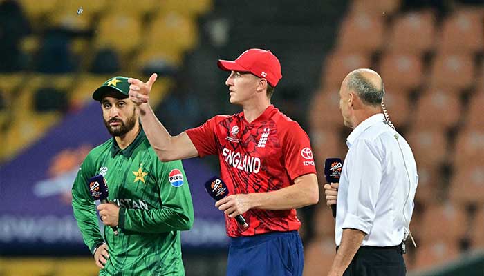 Englands captain Harry Brook (C) tosses the coin as his Pakistan counterpart Salman Agha (L) watches before the start of the 2026 ICC Mens T20 Cricket World Cup Super Eights match between England and Pakistan at the Pallekele International Cricket Stadium in Kandy on February 24, 2026. — AFP