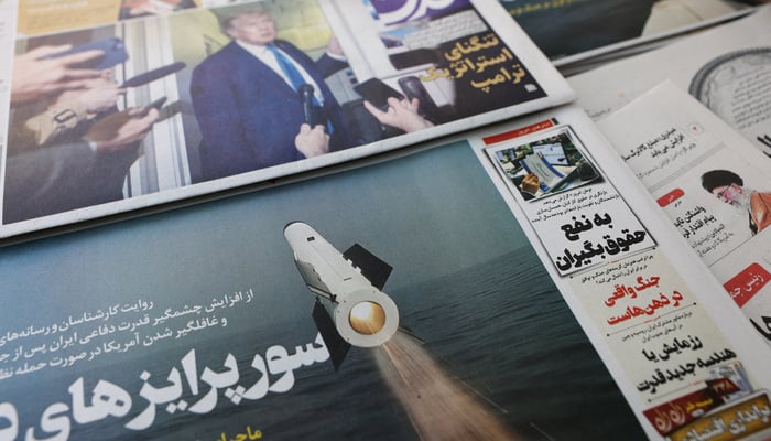 An Iranian newspaper with a cover photo of an Iranian missile, in Tehran, Iran, February 19, 2026. — Reuters