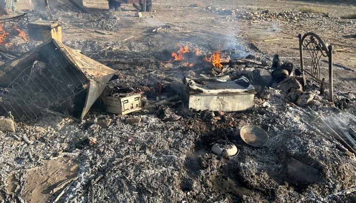 Fire burns outside a house following violent attack in Buleda area of Turbat, where unknown assailants opened fire, leaving six dead and two injured, February 25, 2026. — Geo News