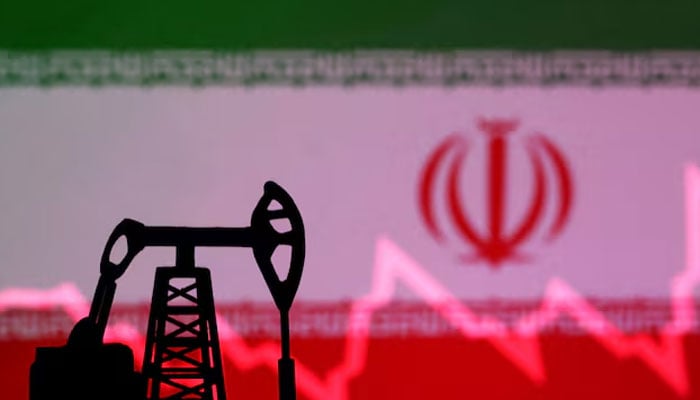 Iranian flag with stock graph and an oil pump jack miniature model are seen in this illustration taken October 9, 2023. — Reuters