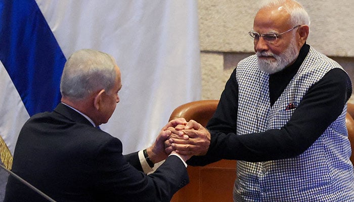 Israels Prime Minister Benjamin Netanyahu greets Indias Prime Minister Narendra Modi, during a special session of the Knesset, Israels parliament, in Jerusalem February 25, 2026. — Reuters