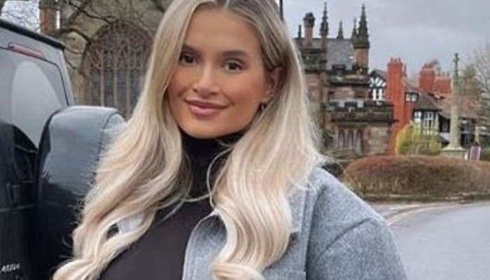 The Maebe founder covered her growing baby bump in a oversized zip-up bomber jacket