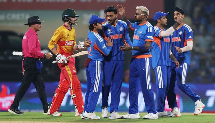 Indias Axar Patel celebrates with teammates after taking the wicket of Zimbabwes Tadiwanashe Marumani, caught out by Ishan Kishan in the ICC T20 World Cup Super Eight clash on February 26, 2025. — Reuters