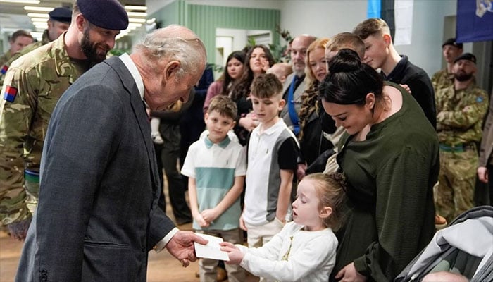 King Charles enjoys tender moment with young girl at Barracks