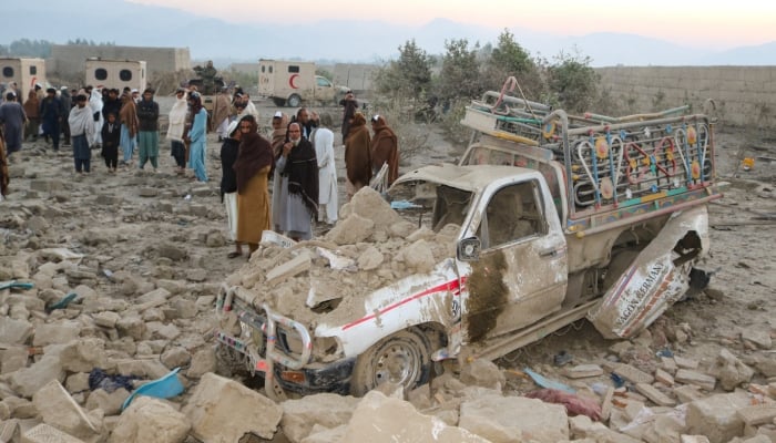 Residents gather at the site, following the Pakistani airstrikes, in Bihsud district, Nangarhar province, Afghanistan, February 22, 2026. — Reuters