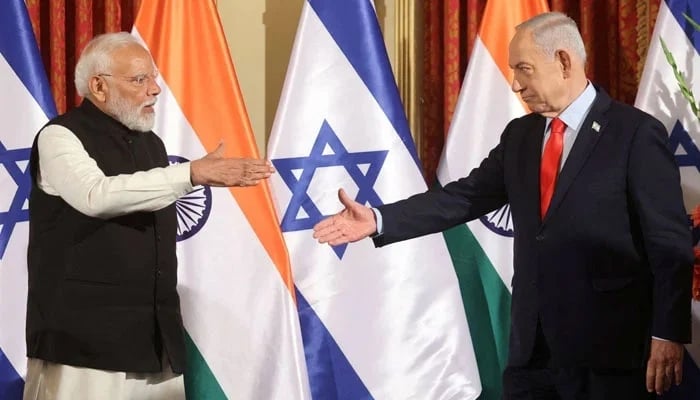 Israels Prime Minister Benjamin Netanyahu and Indias Prime Minister Narendra Modi reach to shake hands as they attend a press conference in Jerusalem on February 26, 2026. — Reuters