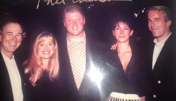 This undated photo released by Democrats on the House Oversight Committee shows former President Bill Clinton, Ghislaine Maxwell and Jeffrey Epstein, with Clinton’s signature at the top of the photo. — AFP