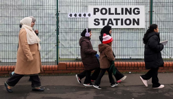 Embarrassing defeat for UK's Starmer as Greens seize Labour stronghold 11 Women and children walk past a signage outside a polling station at St Agnes Primary School, on the day of the Gorton and Denton by-election, triggered by the resignation of Andrew Gwynne, in Gorton, Manchester, Britain, February 26, 2026. — Reuters