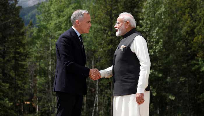 Canadian Prime Minister Mark Carney and Indias Prime Minister Narendra Modi shake hands before posing for a photo during the G7 Leaders Summit in Kananaskis, in Alberta, Canada, June 17, 2025.— Reuters/File