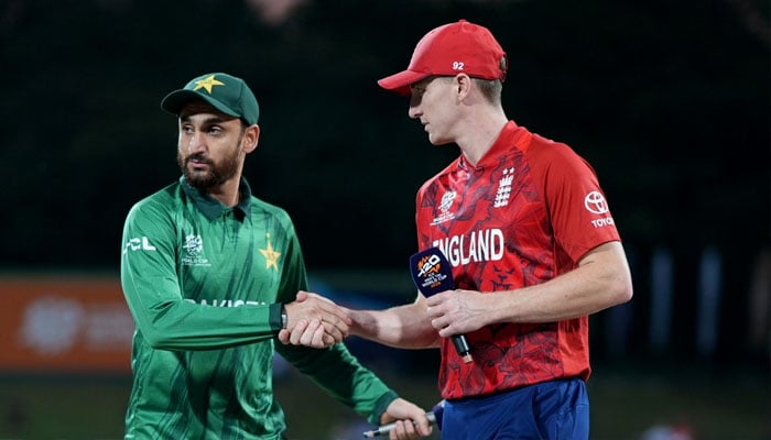 Pakistans captain Salman Agha (left) shake hands with England captain Harry Brook at the toss during the ICC T20 World Cup Super Eight match on February 24, 2026. — PCB