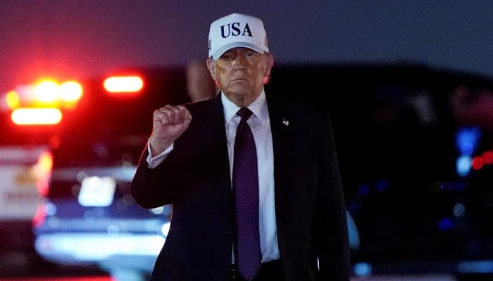 US President Donald Trump pumps his fist after disembarking Air Force One at Palm Beach International Airport in West Palm Beach, Florida, US, February 27, 2026. — Reuters
