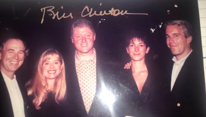 This undated photo released by Democrats on the House Oversight Committee shows former President Bill Clinton, Ghislaine Maxwell and Jeffrey Epstein, with Clinton’s signature at the top of the photo. — Reuters