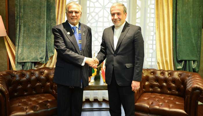 Deputy Prime Minister and Foreign Minister Senator Ishaq Dar shakes hands with Iranian FM Abbas Aragchi ahead of bilateral meeting in Iran on December 3, 2024. — PID
