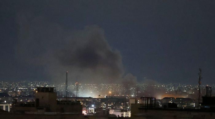 US-Israeli strikes hit Iran port near Strait of Hormuz, five killed