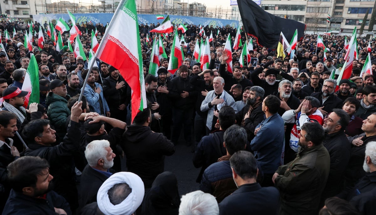 People react as they gather at the Enghelab Square, after Irans Supreme Leader Ayatollah Ali Khamenei was killed in Israeli and US strikes on Saturday, in Tehran, Iran, March 1, 2026. — Reuters