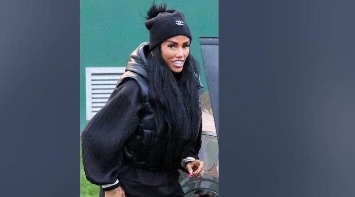 Katie Price all smiles on UK shopping trip as Lee Andrews stays in Dubai