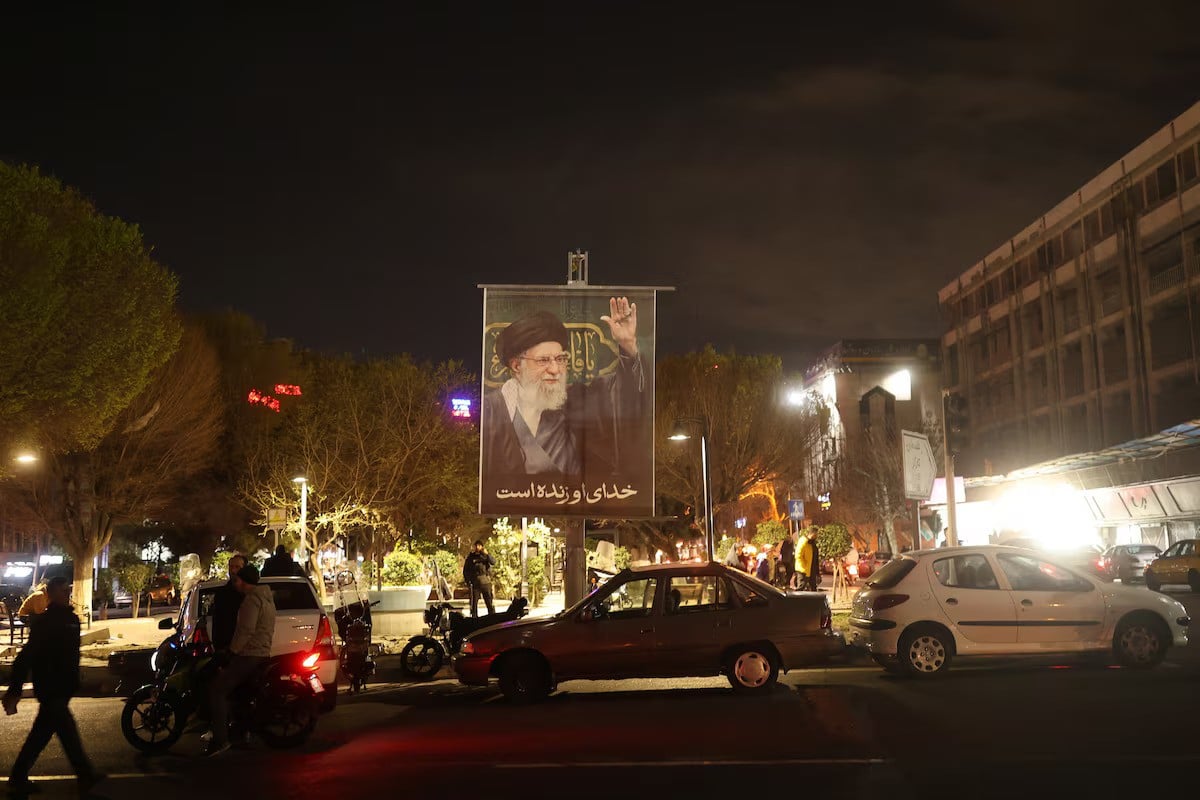 A banner of Irans Supreme Leader Ayatollah Ali Khamenei on a street, after he was killed in Israeli and U.S. strikes on Saturday, in Tehran, Iran, March 1, 2026. — Reuters