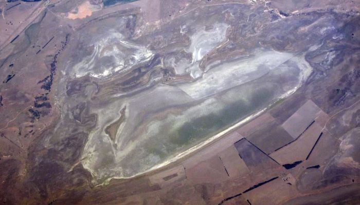 A lake with low levels of water can be seen in a drought-affected farming land on the outskirts of Canberra in Australia, January 12, 2016. — Reuters
