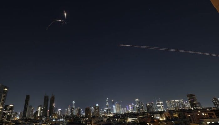 Rocket trails are seen in the sky amid a fresh barrage of Iranian missile attacks above the Israeli coastal city of Tel Aviv on March 3, 2026. — AFP