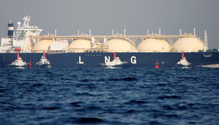 A liquefied natural gas tanker is tugged is pictured on November 13, 2017. — Reuters