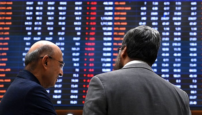 Stockbrokers react while monitoring share prices at the Pakistan Stock Exchange (PSX) in Karachi on March 2, 2026. — AFP