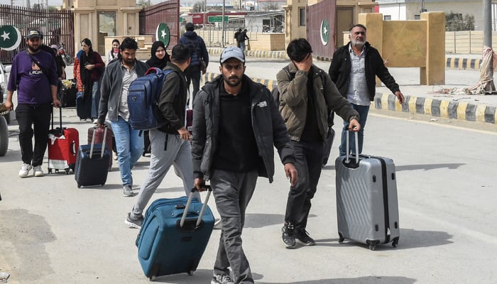Pakistanis at remote border describe scramble to leave Iran 13 Pakistani nationals walk across the Pakistan-Iran border after returning from Iran at Taftan, Balochistan province on March 2, 2026 after the death of Irans supreme leader Ayatollah Ali Khamenei amid US-Israel strikes. — AFP