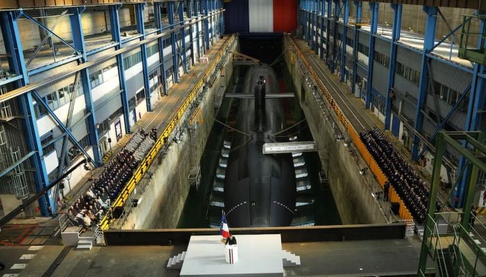 French President Emmanuel Macron delivers a speech next to the submarine Le Temeraire (The Temerarious) at the nuclear submarines Navy base Ile Longue in Crozon, France, March 2, 2026. — Reuters