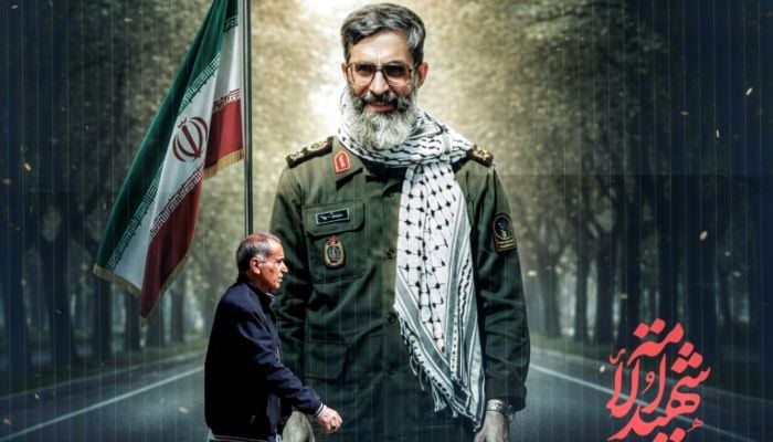 A man walks past a banner depicting an illustration of a younger Ayatollah Ali Khamenei, in Tehran. — AFP