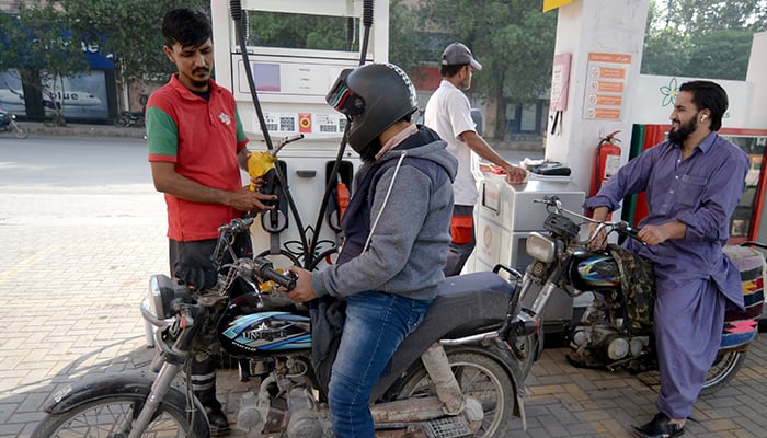 A fuel station worker filling petrol in a motorcycle in Karachi, on January 1, 2026. — PPI