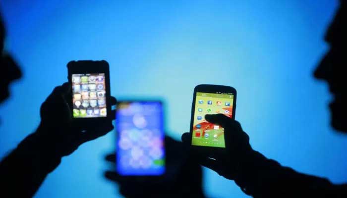 A representative image of several people using mobile phones. — Reuters/File