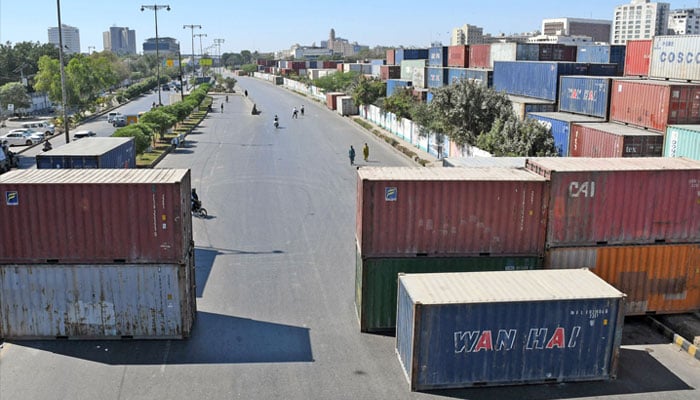 Shipping containers have been placed on a road leading to US Conculate in Karachi on March 4, 2026. — Online