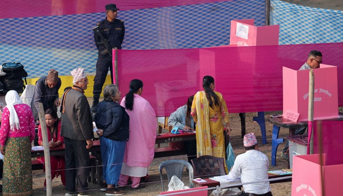 Nepal goes to the polls; voters seek change after youth-led protests 13 People queue to vote as a member of the Nepal police stands guard at a polling station during the general election in Damak, Jhapa district, Nepal, March 5, 2026. — Reuters