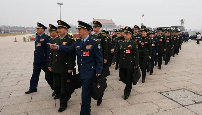 Military delegates walk at Tiananmen Square ahead of the opening session of the Chinese Peoples Political Consultative Conference (CPPCC) at the Great Hall of the People in Beijing, China, March 4, 2026. — Reuters