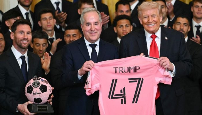 Inter Miami´s Argentine forward Lionel Messi, Inter Miami´s managing owner Jorge Mas and US President Donald Trump pose with a 47 jersey and a signed ball during an event honoring Inter Miami CF, winners of the 2025 Major League Soccer Cup, in the East Room of the White House in Washington, DC, on March 5, 2026. — AFP