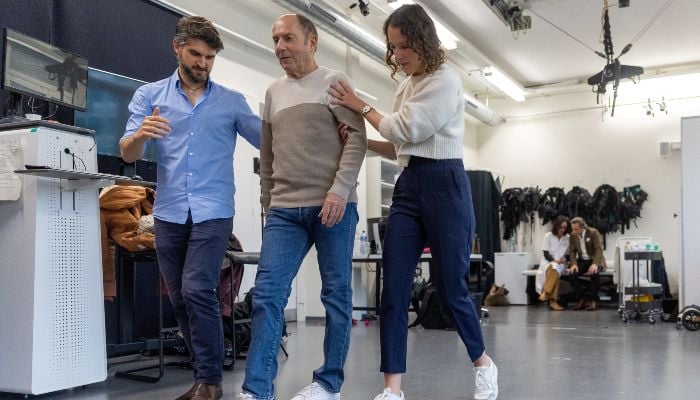 Marc Gauthier, 63, demonstrates his disorder with the help of Eduardo Martin Moraud, Head of Parkinsons Research at NeuroRestore, and Camille Varescon, Clinical Research Engineer, during a media presentation at the CHUV in Lausanne, Switzerland, November 2, 2023. — Reuters