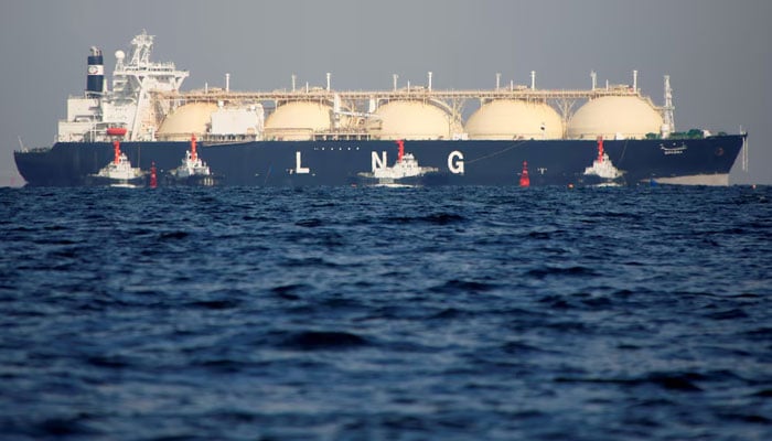 A liquefied natural gas (LNG) tanker is tugged towards a thermal power station in Futtsu, east of Tokyo, Japan. — Reuters/File