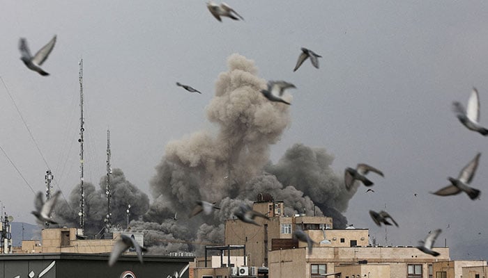 Birds fly as smoke rises following an explosion, after Israel and the US launched strikes on Iran, amid the US-Israel conflict with Iran, in Tehran, Iran on March 2, 2026. — Reuters