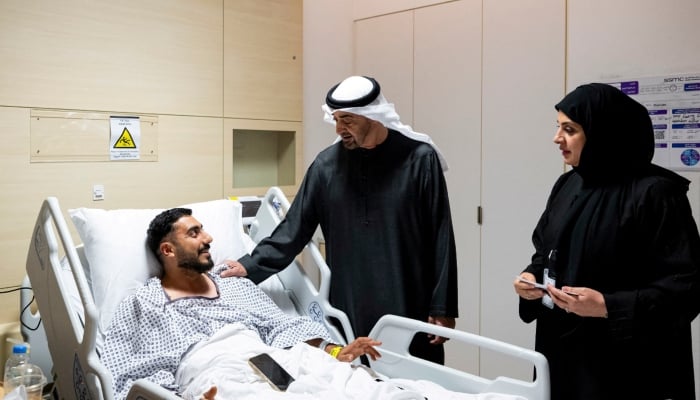 UAE President Sheikh Mohamed bin Zayed Al Nahyan meets an injured patient receiving treatment at a hospital in Abu Dhabi, United Arab Emirates, March 6, 2026. — Reuters