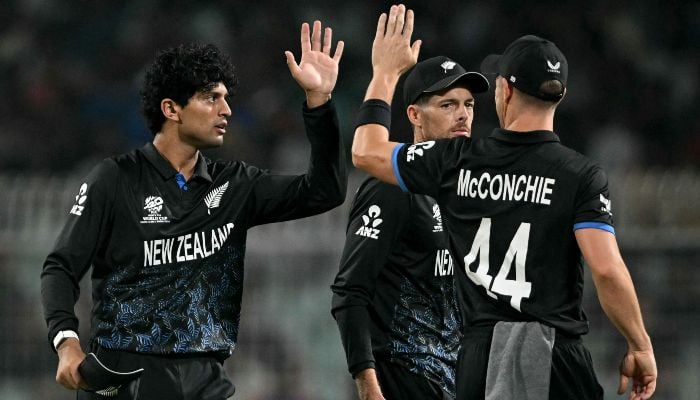 New Zealands Rachin Ravindra (L) celebrates with teammates after taking the wicket of South Africas David Miller during the 2026 ICC Mens T20 Cricket World Cup semi-final match between New Zealand and South Africa at the Eden Gardens in Kolkata on March 4, 2026. — AFP