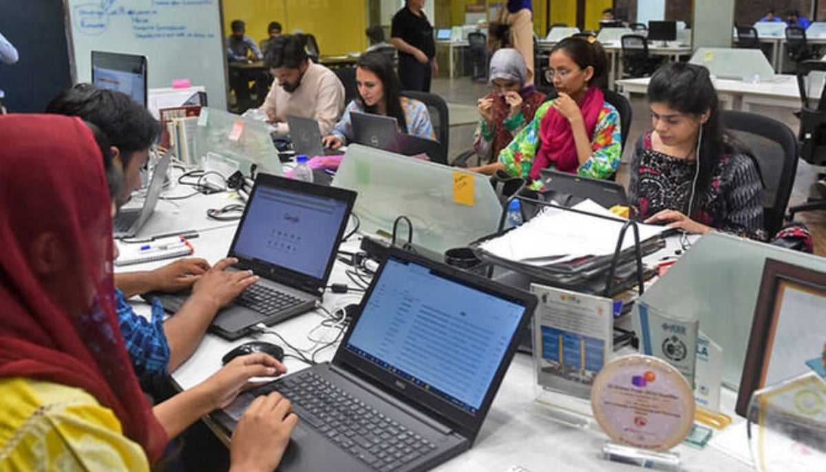 People work at their stations at an incubation centre in Lahore. — AFP/File