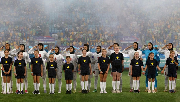 Iran’s players salute during the national anthem before the AFC Women’s Asian Cup Australia 2026 football match between Iran and Australia in Gold Coast. — AFP
