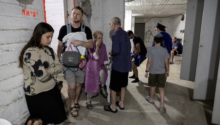 Israelis gather in a bomb shelter following sirens in Tel Aviv in this undated photo. — Reuters