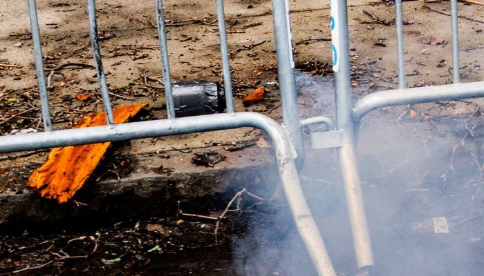 Smoke emits from an explosive device during an anti-Islam protest by supporters of far-right activist Jake Lang, which also drew counter protesters, outside Gracie Mansion, the official residence of New York Mayor Zohran Mamdani, in New York City, New York, US, March 7, 2026. — Reuters