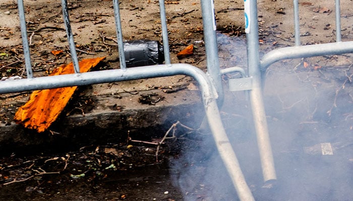Smoke emits from an explosive device during a protest by supporters of far-right activist Jake Lang in New York City, US, March 7, 2026. — Reuters