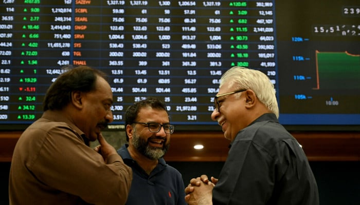 Stockbrokers interact during a trading session at Pakistan Stock Exchange (PSX) in Karachi on May 12, 2025. — AFP
