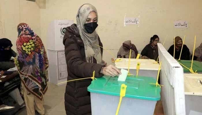 A female voter casts her vote at a polling station during general elections 2024, in Lahore on Thursday, February 8, 2024. — PPI