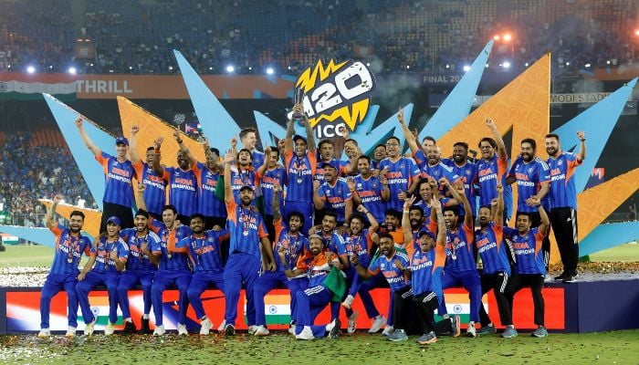 Indias Suryakumar Yadav lifts the trophy as he celebrates with teammates after winning the ICC Mens T20 World Cup, Narendra Modi Stadium, Ahmedabad, India, March 8, 2026. — Reuters